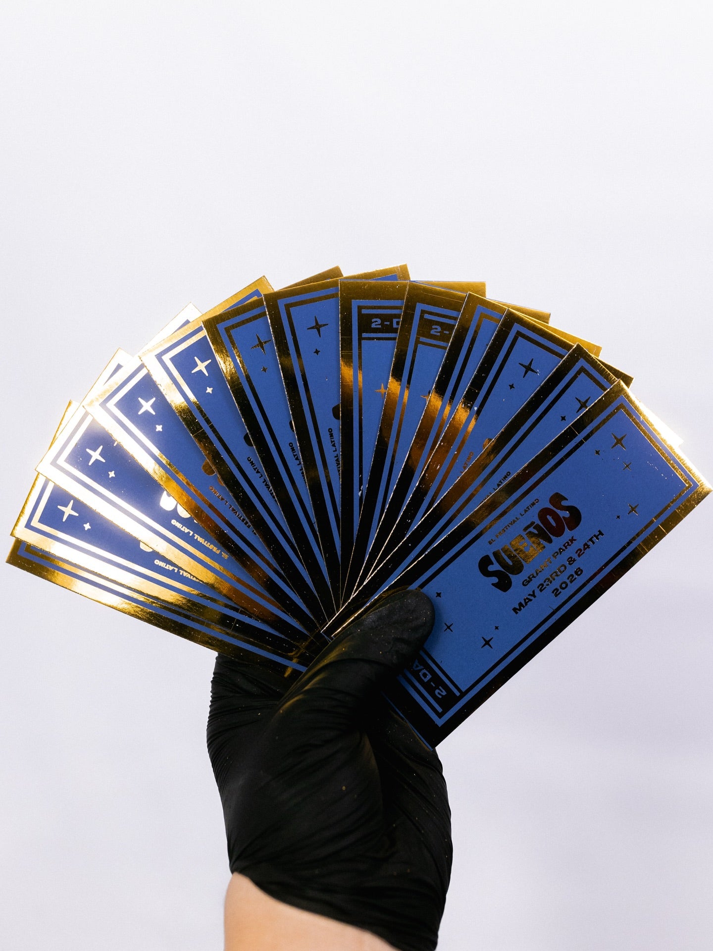 Gold-foil Sueños festival tickets printed by Stickerz