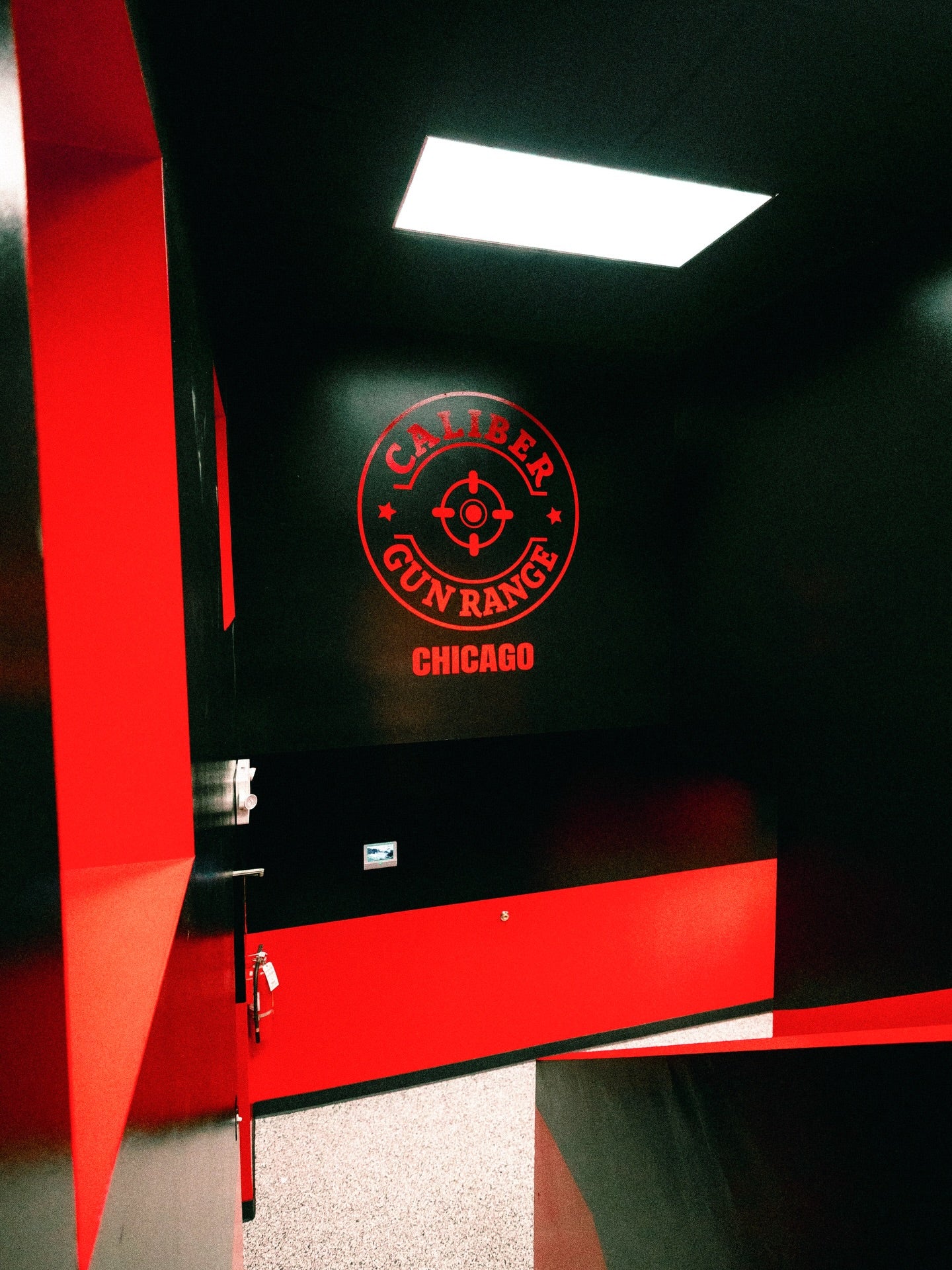 Finished gloss-red wall logo installed by Stickerz